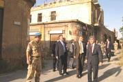 UNFICYP Chief of Mission Zbigniew Wlosowicz, the Secretary-General's Special Representative in Cyprus (right), the European Commissioner for Enlargement Olli Rehn and Nicolas Schmit